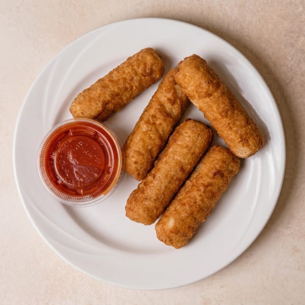 Five golden-brown fried mozzarella sticks and a small container of red marinara sauce on a white plate.